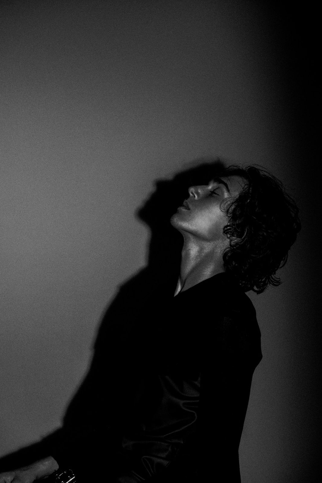 Brixton Berry of BR!X, black and white portrait, head tilted back